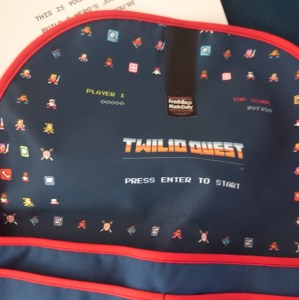 Lining of the bag shows cute 8-bit players.